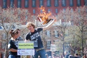 Matthis Chiroux of the IVAW burns an American flag in Lafayette Park, DC