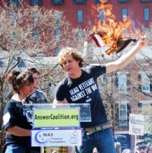 IVAW's Matthis Chiroux, Robyn Murray and MFSO's Elaine Brower burn the US flag "This is not my country!"