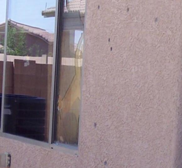 Guerena bullet ridden wall