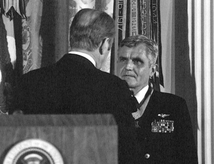 050706-N-0000X-002 Navy File Photo: Washington, D.C. (March 4, 1976) - President of the United States of America, Gerald R. Ford, (back to camera) presents the Congressional Medal of Honor to Rear Admiral James B. Stockdale, USN, during an awards ceremony in the East Room of the White House. Rear Admiral Stockdale earned the nation's highest decoration for his leadership as a Prisoner of War in North Vietnam from 9 Sept. 1965 to 12 Feb. 1973. U.S. Navy Photo by Dave Wilson (RELEASED)