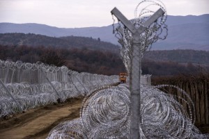 A special army vehicle paves a road between the two fences at the border line between Greece and Macedonia near the city of Gevgelija, The Former Yugoslav Republic of Macedonia, Feb. 18, 2016. Worried that the country may become stuck with thousands of people if countries to the north clamp down, Macedonia began reinforcing and expanding a mesh- and razor-wire fence on the path of migrants arriving from Greece. Thousands of refugees continue to pass through Macedonia on their way to the European Union.  (EPA/GEORGI LICOVSKI)